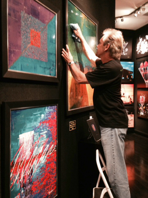 Byron cleaning art at Signature Gallery ay Planet Hollywood 1